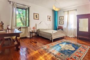 Postel nebo postele na pokoji v ubytování B&B Due Fiumi 1908