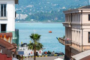 a view of a large body of water between two buildings at Hotel N16 in Batumi