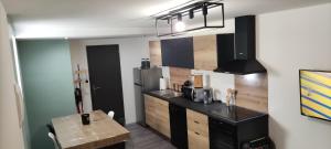 Kuchyň nebo kuchyňský kout v ubytování loft industriel L'Idaho
