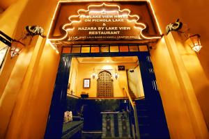 an entrance to a building with a sign on it at The Lake View Hotel- On Lake Pichola in Udaipur