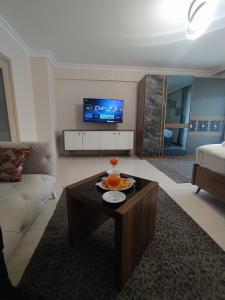 a living room with a couch and a coffee table at Bolu Deluxe Otel in Bolu