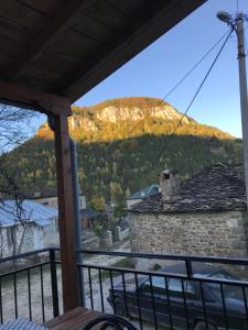 a view of a mountain from the porch of a house at Vila Korchari Dardhe in Korçë +4 photos