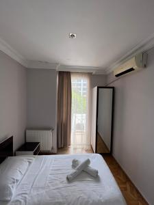 Postel nebo postele na pokoji v ubytování Hotel Dolphin Batumi