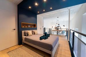 Кровать или кровати в номере Atypique LOFT Mons City Center