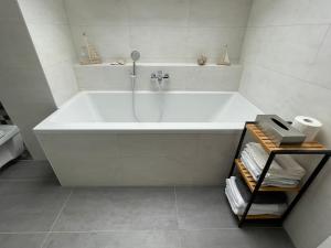 a white bath tub in a white bathroom at BNB Klinga in Klinga