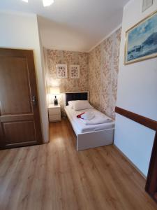 Postel nebo postele na pokoji v ubytování Paula Wellness & SPA