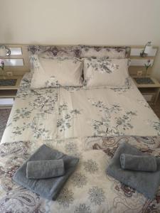 a large bed with two pillows on top of it at Apartment Privat in Sunny Beach in Sunny Beach