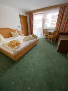 Posteľ alebo postele v izbe v ubytovaní Haus Pregenzer