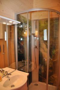 a bathroom with a shower and a sink at Ferienhaus Altmann 2 in Sankt Magdalena