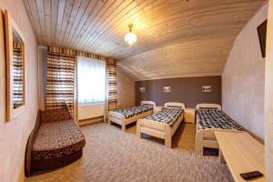 Кровать или кровати в номере Hotel Gutsulia