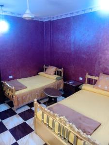 A bed or beds in a room at App11- BELAL - Enjoy the privacy of staying in a quiet apartment with free Wi-Fi as your complete second home in the heart of Hurghada