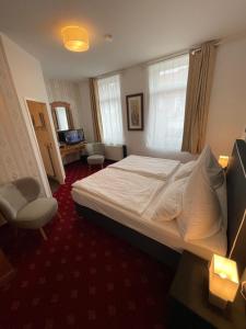 Ein Bett oder Betten in einem Zimmer der Unterkunft dS Hotel Bad Bentheim