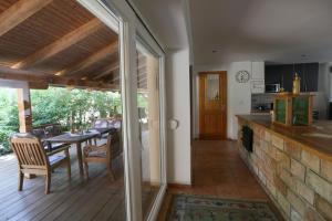 a kitchen and dining room with a table and a dining room at EHM Family Resort in Mesteri