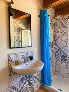 a bathroom with a sink and a mirror at B&B Pelagos in Castellammare del Golfo