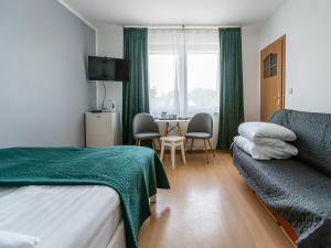 Postel nebo postele na pokoji v ubytování Amber Dom Gościnny