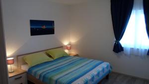 Postel nebo postele na pokoji v ubytování Apartments Barić Kučište