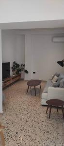 a living room with a couch and a table at Casa Manny in Rhodes Town