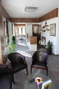 A seating area at Milano Hotel