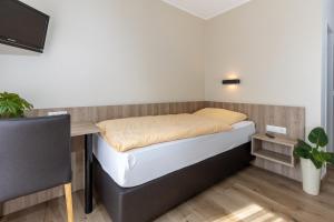 Ein Bett oder Betten in einem Zimmer der Unterkunft Landgasthaus Berns De Bakker