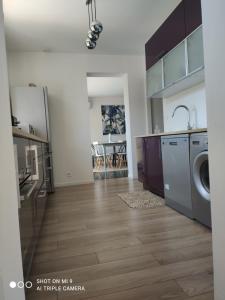 a kitchen with a sink and a washing machine at Villa Melbemar in Six-Fours-les-Plages