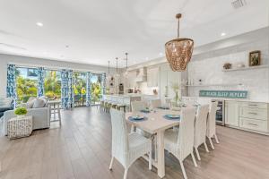 a kitchen and living room with a table and chairs at Shore Thing in Sarasota