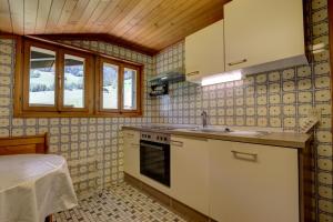 Kjøkken eller kjøkkenkrok på Appartement Les Cascades