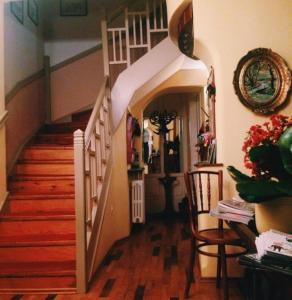 a living room with a staircase and a stair case at Ada Apartments in Sarajevo