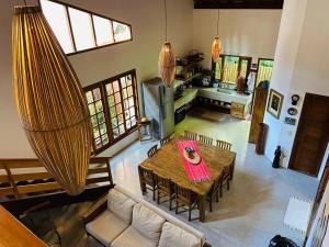 an overhead view of a living room with a table and chairs at Casa Gungalilin Trancoso in Trancoso