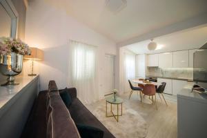 a living room with a couch and a table at LUX GARDEN Luxury Apartment Split in Split