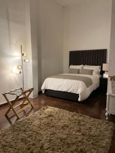 Giường trong phòng chung tại Suite Copal