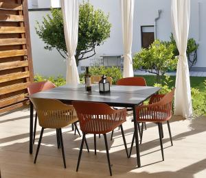 a black table and chairs on a patio at Villa Klara in Vodice