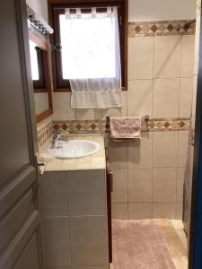a small bathroom with a sink and a window at Fiori Di Santa Giulia in Porto-Vecchio +37 photos