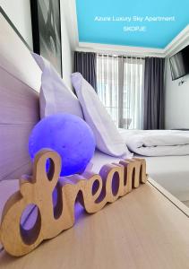 a bedroom with a bed with a toy train on the floor at Azure Luxury Sky Apartment in Skopje