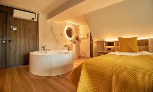 Postel nebo postele na pokoji v ubytování Hotel Hoogeveen