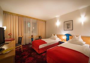 Säng eller sängar i ett rum på Hotel Boltzmann
