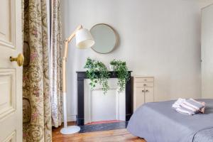 Zdjęcie z galerii obiektu Appartement cosy chaleureux Proche Paris - Defense w mieście Suresnes