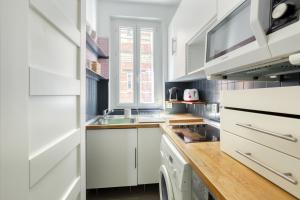 Zdjęcie z galerii obiektu Appartement cosy chaleureux Proche Paris - Defense w mieście Suresnes