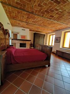 Postel nebo postele na pokoji v ubytování Cascina Flino - Tra le vigne - Appartamento 2