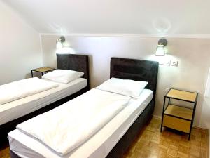 Postel nebo postele na pokoji v ubytování Hotel Maj Inn