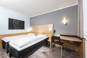 A bed or beds in a room at Good Morning Erfurt