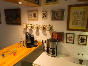 a kitchen with a counter with a coffee maker on it at Guest House Bellaguarda in Altea