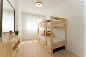 Posteľ alebo postele v izbe v ubytovaní Apartamento de lujo de dos dormitorios