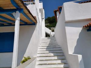 a stairway leading up to a white building at Alexandra's Studios in Kechria