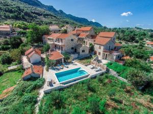 an aerial view of a house with a swimming pool at Villa Natura in Pitve