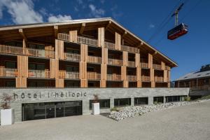 a building with a ski lift above it at Heliopic Hotel & Spa in Chamonix