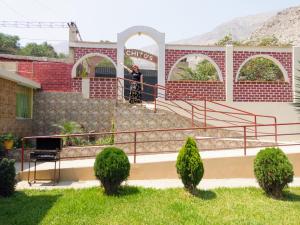 a man standing on the stairs of a building at Amachito's Casa Recreacional in Lima