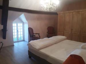Posteľ alebo postele v izbe v ubytovaní Grand gîte au château de Betz-le-Château