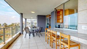 a kitchen and dining room with a table and chairs at Boulevard Bonanza by Top Destinations Rentals in Margate