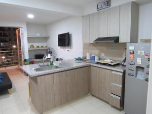 Kuchyň nebo kuchyňský kout v ubytování Precioso apartamento con piscina y wifi