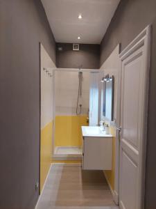 a bathroom with a white sink and a shower at Casa del trogolo in Varazze